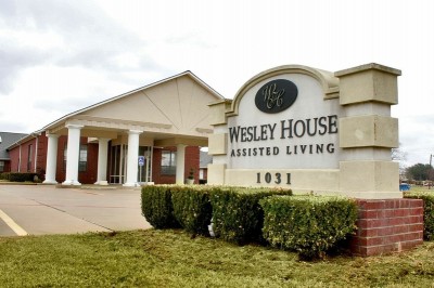 Wesley House Assisted Living sign in front of building