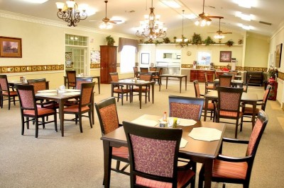 Dining area with chairs and tables with place settings
