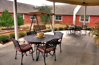 Outside covered patio area with tables and chairs