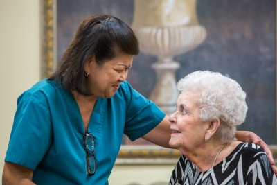 nurse visiting with older lady